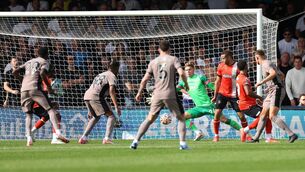 <p>Micky van de Ven (right) scores the winner for Tottenham at Luton (Bradley Collyer/PA)</p>