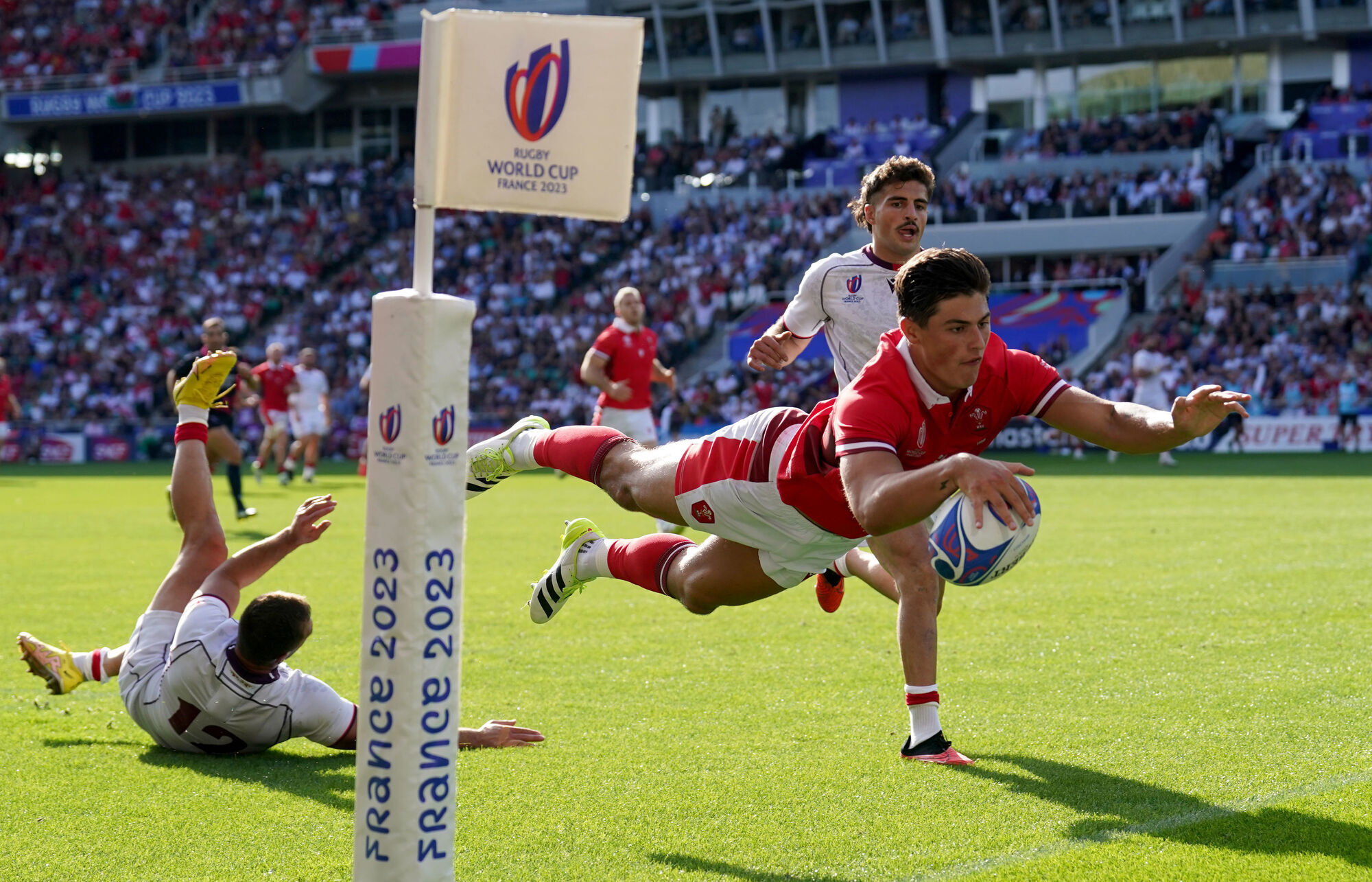 Wales' Louis Rees-Zammit scores his sides fourth try of the game during the Rugby World Cup 2023, Pool C match at Stade de la Beaujoire in Nantes, France. Picture: David Davies/PA Wire. 