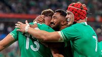 Inpho Garry Ringrose celebrates after scoring a try with Bundee Aki and Josh van der Flier 7/10/2023