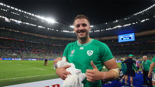 <p>Ireland’s Stuart McCloskey with his newborn baby after the win over Scotland</p>