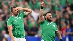 <p>SOAKING IT IN: Ireland players Tadhg Beirne, left, and Andrew Porter celebrate after their side's victory over Scotland at the Stade de France. Pic: Ramsey Cardy/Sportsfile</p>