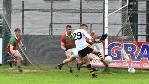 <p>BLOCK: Ronan Barrow, Ballinora, blocking down this shot on goal by Sean Desmond, Glenville, during their Cork Intermediate AFC match at Riverstown. Pic: Dan Linehan</p>