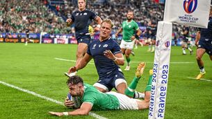 <p>DOTTING DOWN: Hugo Keenan of Ireland dives over to score his side's second try during the victory over Scotland at the Stade de France. Pic: Harry Murphy/Sportsfile</p>