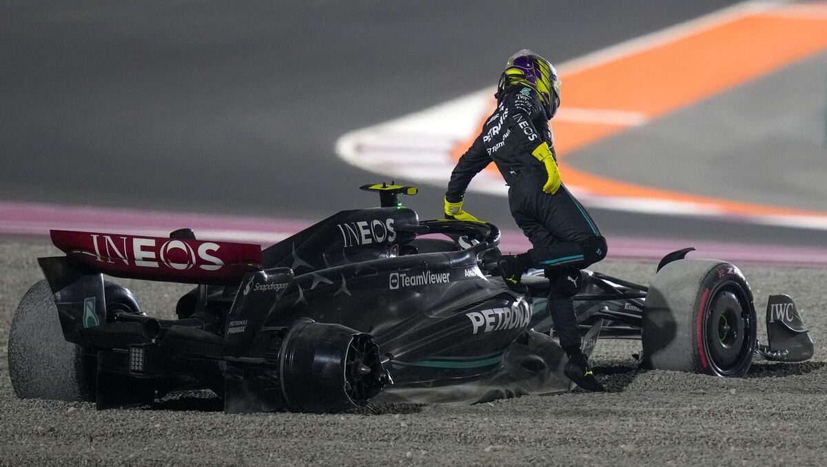 Mercedes driver Lewis Hamilton of Britain goes out from his car after a crash at the start of the Qatar Formula One Grand Prix auto race at the Lusail International Circuit, in Lusail, Qatar, Sunday, Oct. 8, 2023. (AP Photo/Darko Bandic)