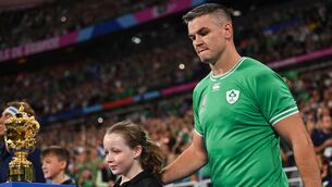 <p>EYES OFF THE PRIZE: Jonathan Sexton of Ireland walks past the William Webb Ellis trophy. Photo by Brendan Moran/Sportsfile</p>