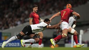 <p>Fiji's Temo Mayanavanua, left, challenges Portugal's Nicolas Martins. (AP Photo/Pavel Golovkin)</p>