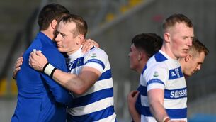 <p>BROTHERS IN ARMS: Castlehaven's Damien Cahalane commiserates with the Barrs' (whom he plays hurling with) after Sunday's Premier SFC semi-final. </p>