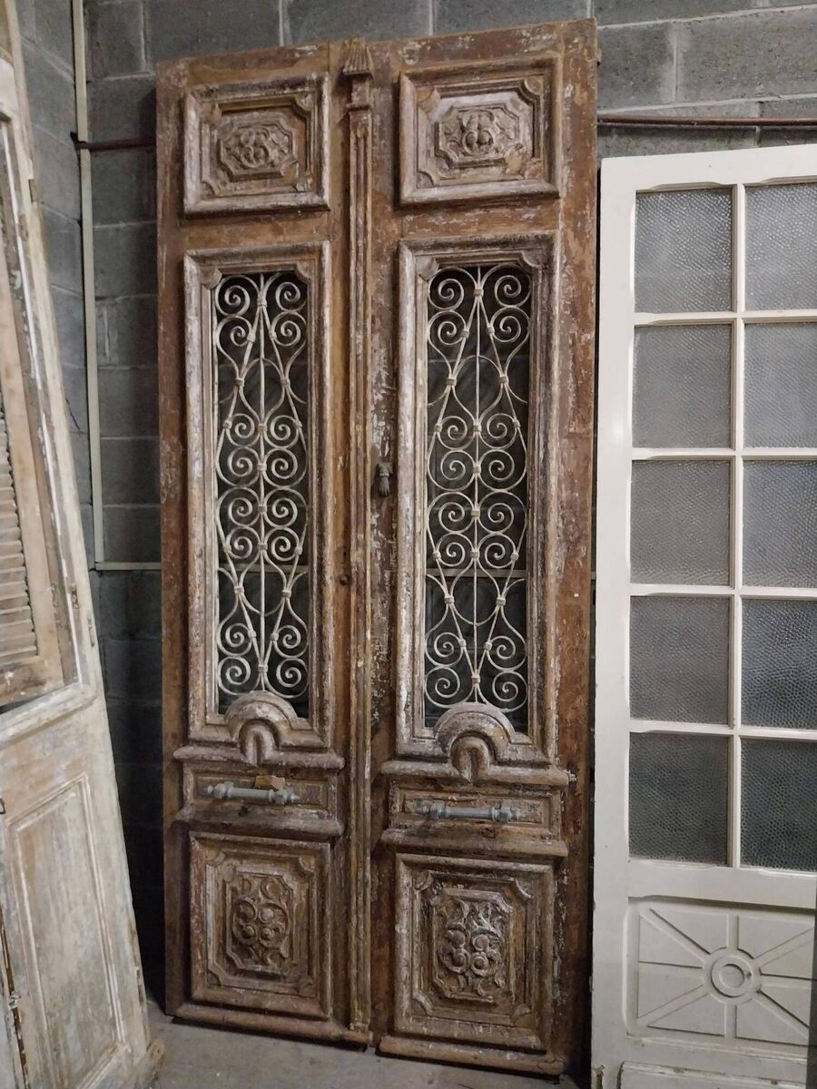 A pair of 18th-century painted pine doors with carved panels at Victor Mee. A pair of 18th-century painted pine doors with carved panels at Victor Mee.