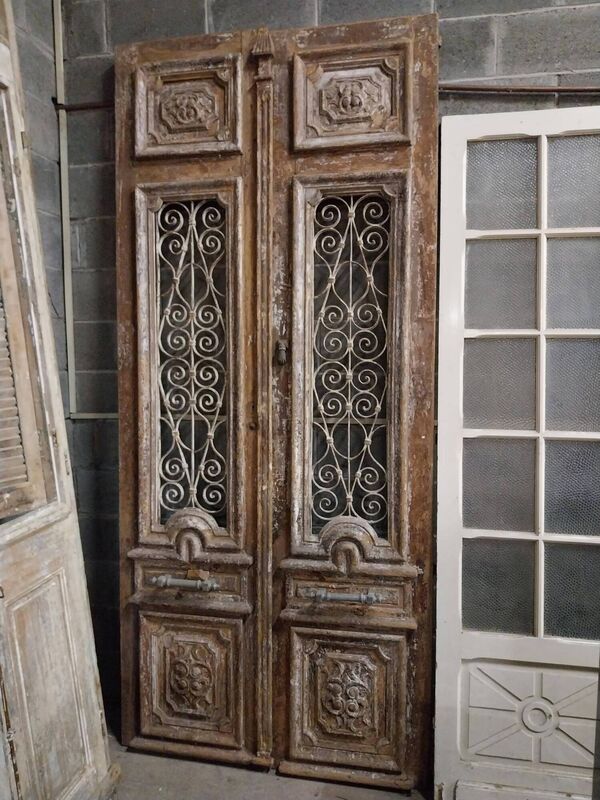 A pair of 18th-century painted pine doors with carved panels at Victor Mee. A pair of 18th-century painted pine doors with carved panels at Victor Mee.
