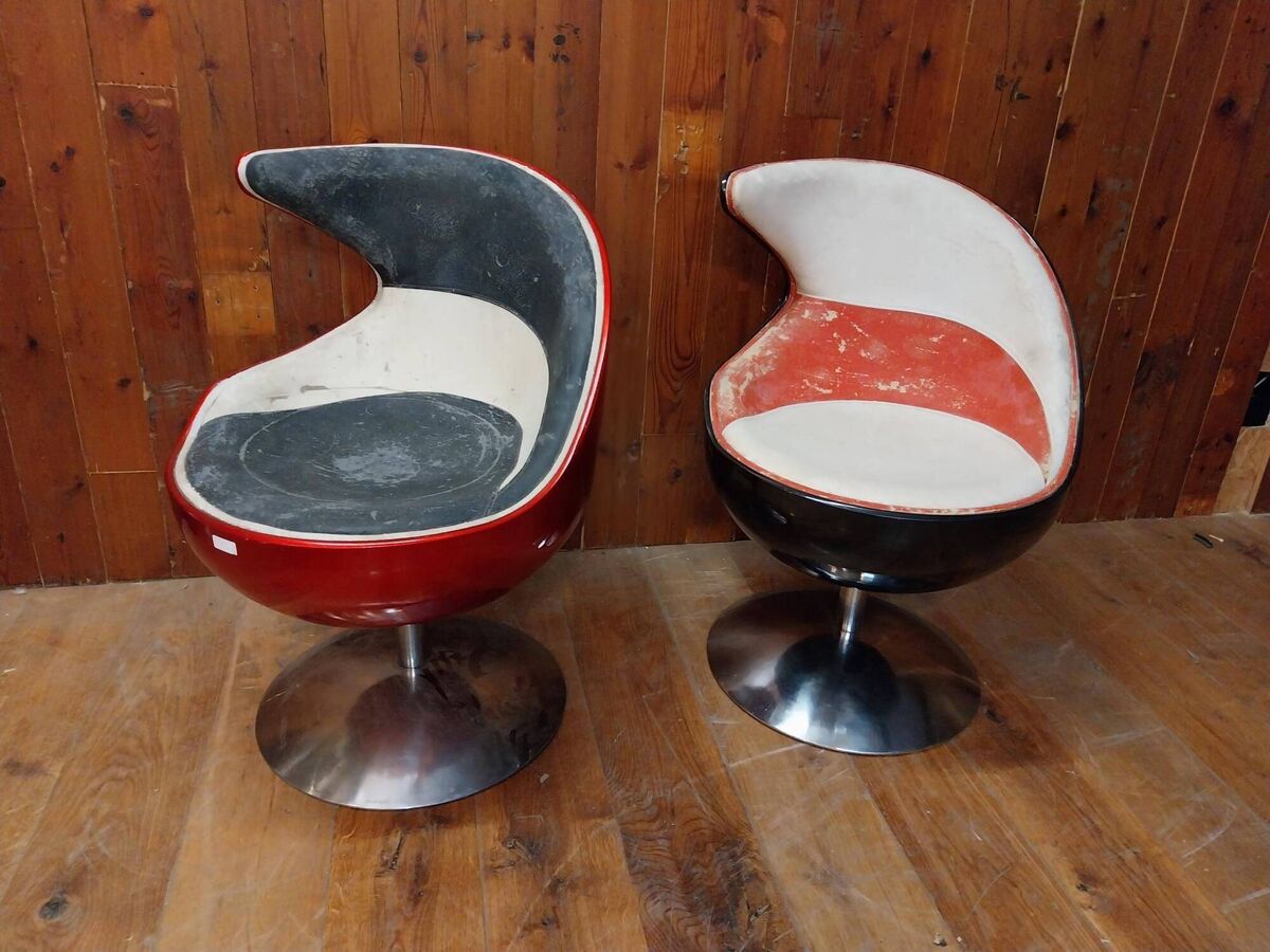 A pair of chrome swivel chairs at Victor Mee. A pair of chrome swivel chairs at Victor Mee.