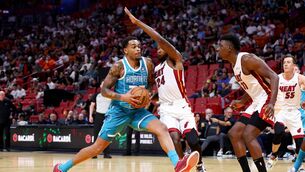 <p>P.J. Washington #25 of the Charlotte Hornets steps to the basket against Haywood Highsmith #24 of the Miami Heat during the third quarter of a preseason game at Kaseya Center on October 10, 2023 in Miami, Florida. The Hornets became the last new NBA franchise in 2004. (Photo by Megan Briggs/Getty Images)</p>