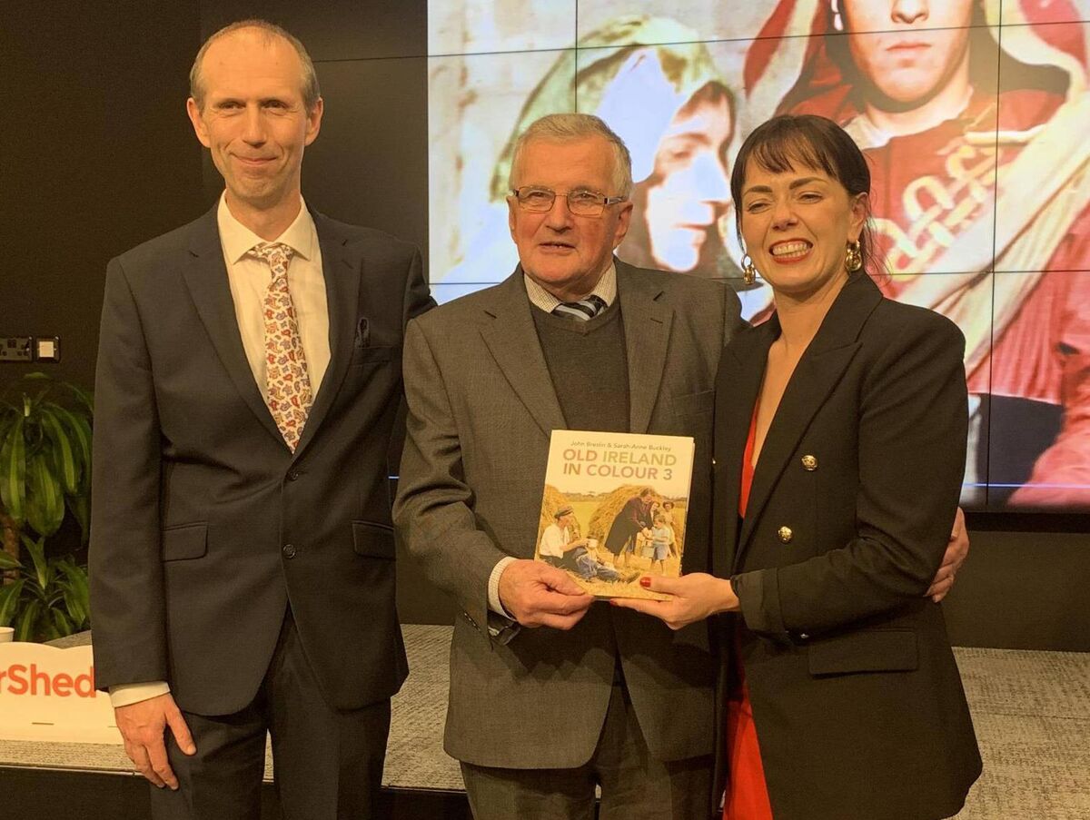 Kevin O'Connor, centre, with Prof John Breslin and Dr Sarah-Anne Buckley, editors of Old Ireland In Colour 3, at the launch of the book in Galway. 
