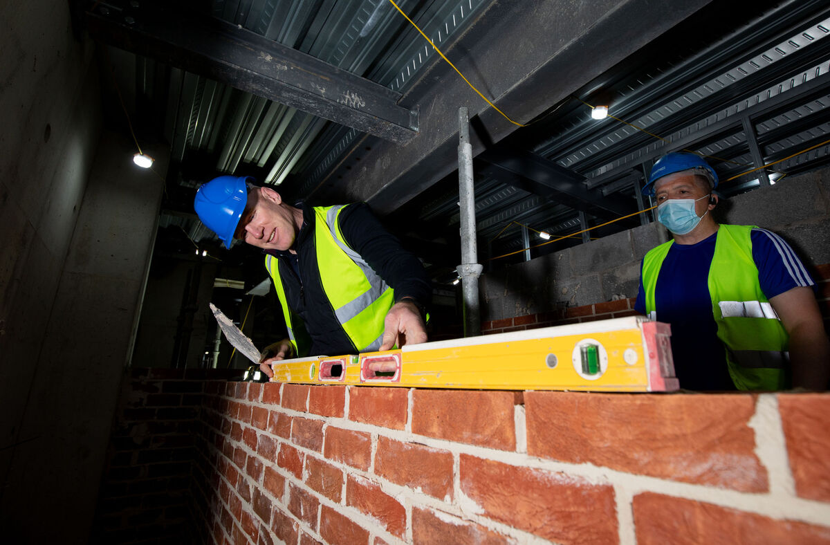 Chair of the International Rugby Experience Paul O'Connell pictured laying bricks. Picture: Alan Place