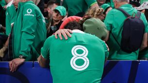 <p>DISTRAUGHT: Ireland’s Caelan Doris with his family after the game </p>