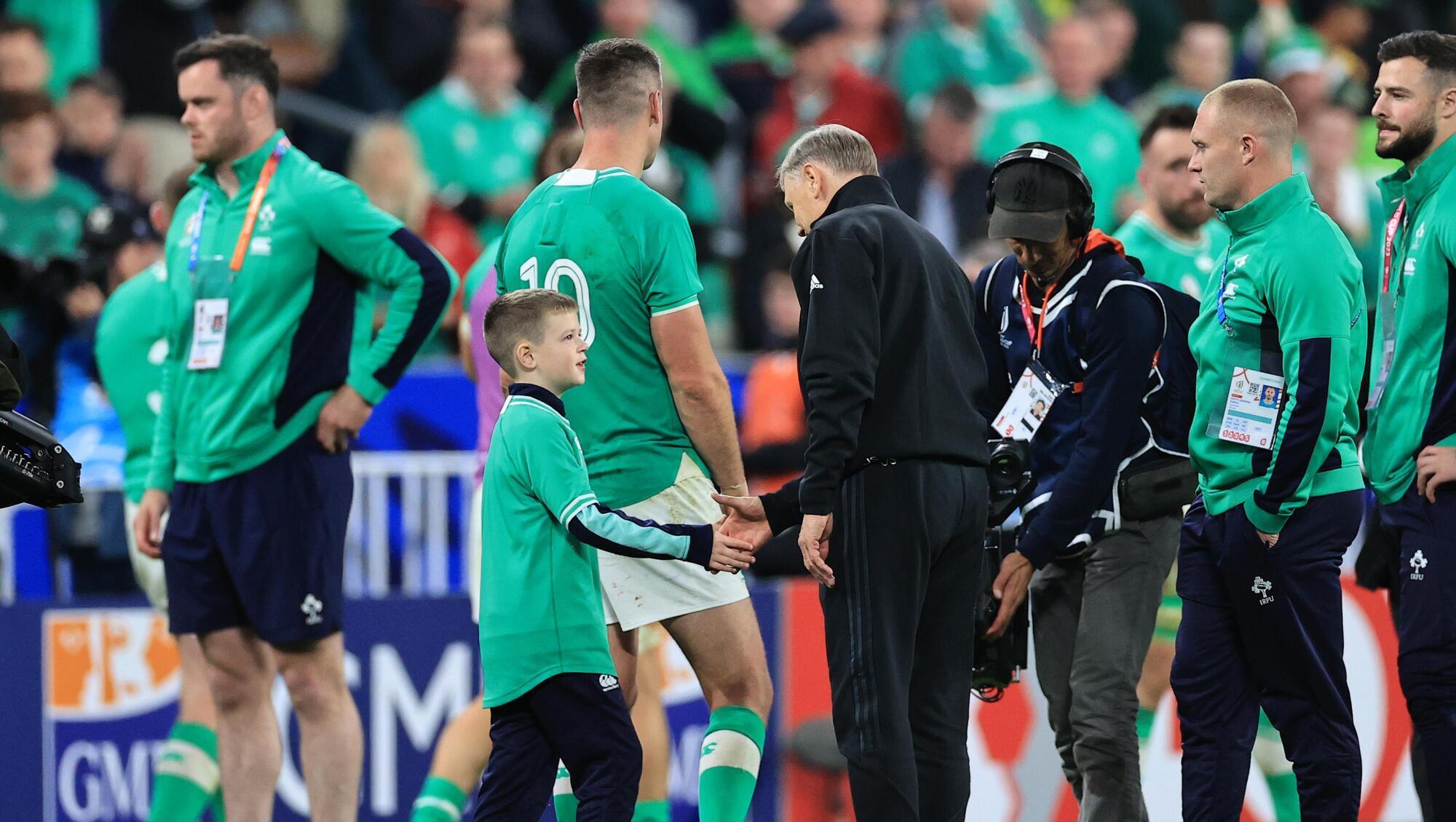 Jonathan Sexton’s son Luca with Joe Schmidt of New Zealand after the game.