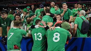 <p>CRESTFALLEN: Josh Van der Flier, Garry Ringrose and Caelan Doris of Ireland are consoled by members of their family at the Stade de France.</p>