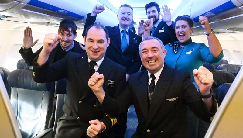 Aer Lingus Pilots Shane Heffernan and Sean Holt with cabin crew Alvaro, Andrew, David, and Lauren, who are flying Irish rugby fans from Cork Airport to Paris for the Rugby World Cup quarter-final against New Zealand. Picture: Eddie O'Hare