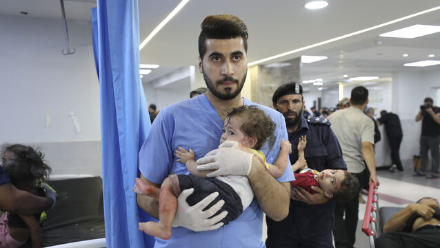 <p>Palestinian children wounded in Israeli strikes are brought to Shifa Hospital in Gaza City. Picture: AP Photo/Ali Mahmoud</p>
