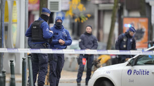 <p>Belgian police stand close to where a suspected Tunisian extremist accused of killing two Swedish soccer fans was shot dead. The images coming through from Brussels late on Monday night were wearyingly familiar. Picture: Martin Meissner/AP</p>