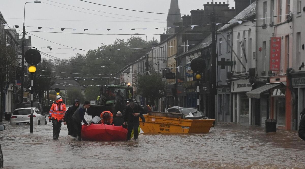 Locals being rescued in from the flooding in Midleton. Picture: Eddie O'Hare