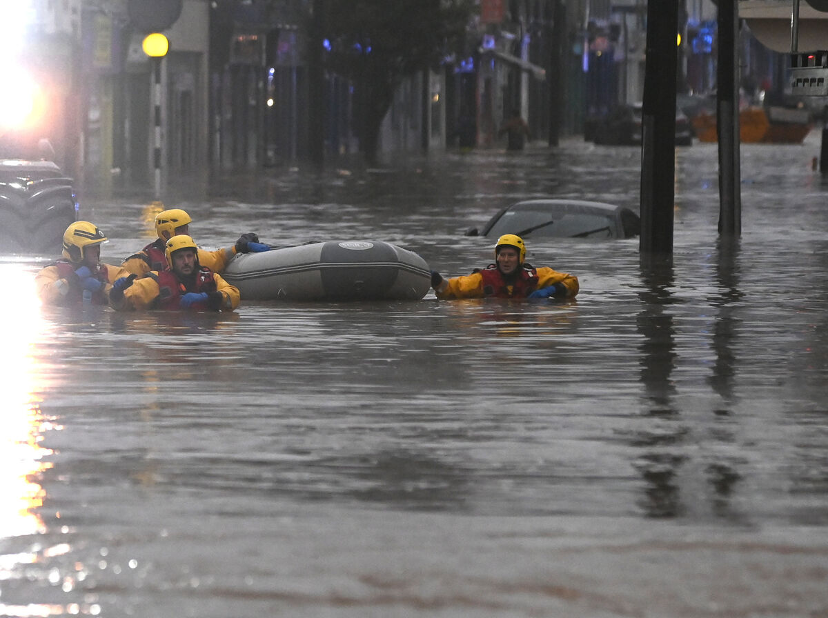 Emergency personnel work in the floods in Main St, Midleton. Picture: Eddie O'Hare Emergency personnel work in the floods in Main St, Midleton. Picture: Eddie O'Hare