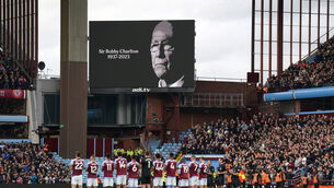 <p>Players and fans observe a tribute to the late  Bobby Charlton ahead of the Premier League match at Villa Park in Birmingham. Picture: Jacob King/PA</p>