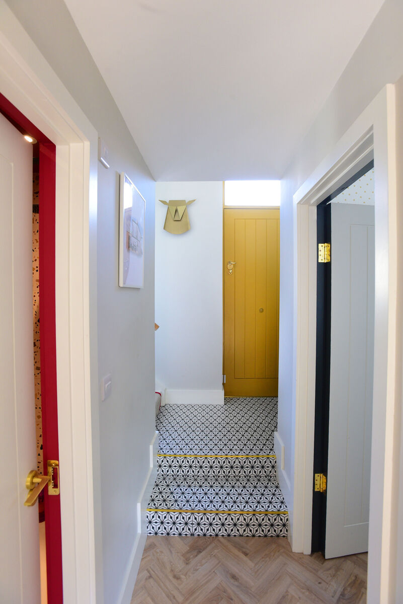 'I love dark doors and windows outside but wanted a bright colour inside.'