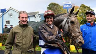 <p>MUDDY MARVEL: Josh Williamson with his dad Norman after Housemartin won the Kilclooney Woods Qualified Riders’ Handicap Hurdle at Clonmel. 	Picture: Healy Racing</p>