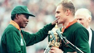 <p>HISTORY MAKERS: South African President Nelson Mandela congratulating Springbok skipper Francois Pienaar after handing him the William Webb Ellis trophy. - The Springboks beat New Zealand 15-12 after over-time in the Rugby World Cup final. </p>