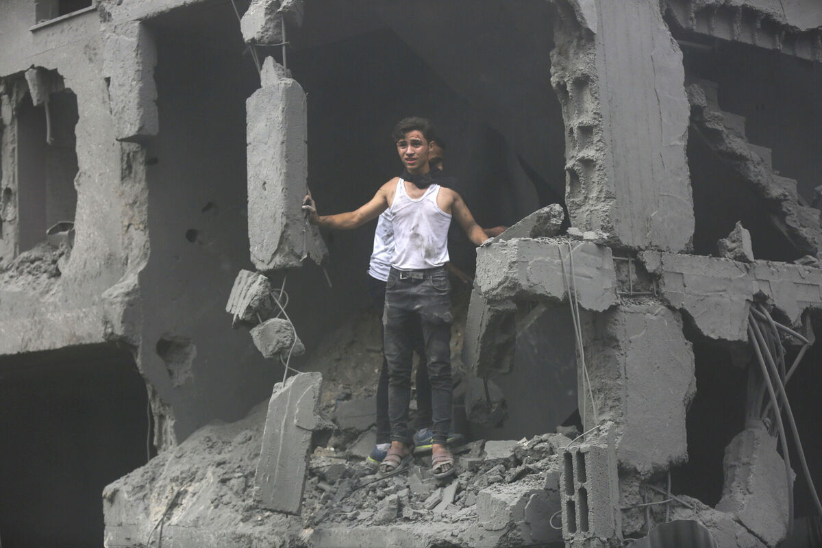 Palestinians inspect the damage of destroyed buildings following Israeli airstrikes on Gaza City, Friday, Oct. 27, 2023. (AP Photo/Abed Khaled)