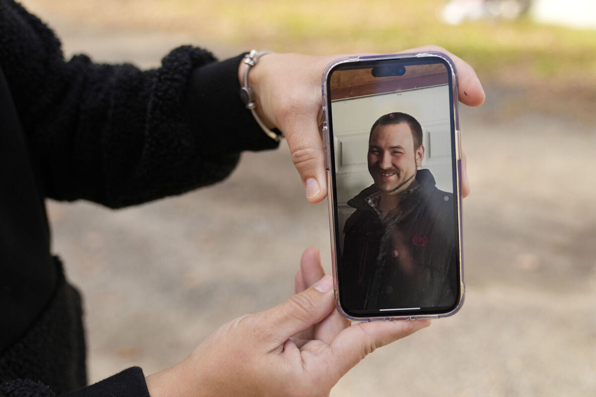 Bonnie Caron shows a photo of Artie Strout, the father of her first child, at her home in Sabattus, Maine, Friday, Oct. 27, 2023. Strout was killed in a shooting in a restaurant in Lewiston, Maine on Wednesday. Picture: AP Photo/Robert F. Bukaty