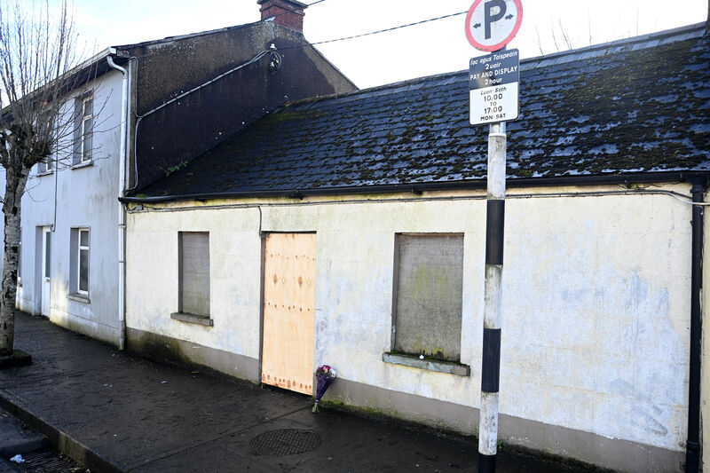  A bouquet of flowers at 9, Beecher St, Mallow, Co Cork on Sunday January 15, 2023, a few days after human remains were found in the house. It was later determined through dental records that the remains were those of Tim O'Sullivan. Picture: Larry Cummins