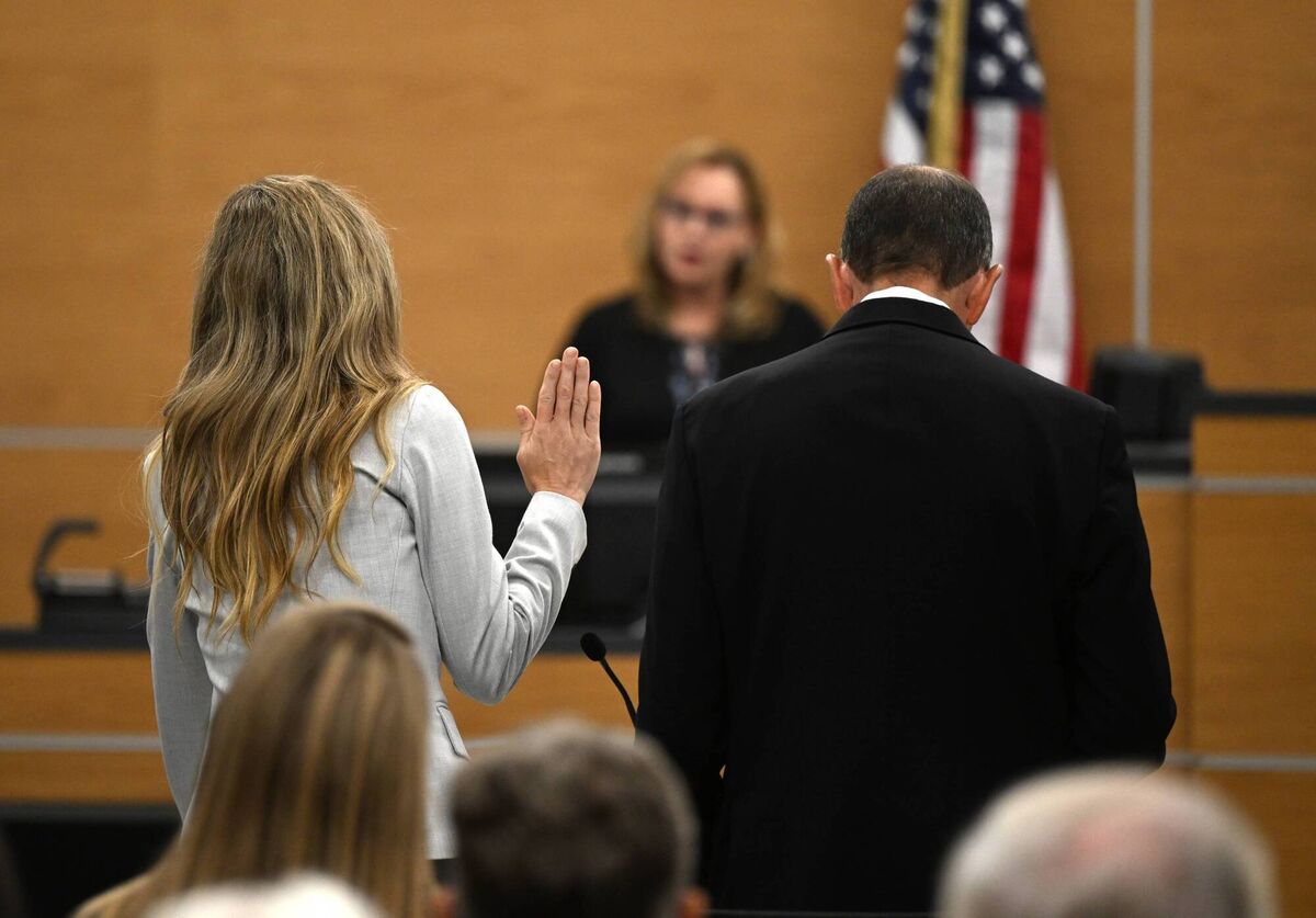 Molly Martens swears on the Bible as she pleads no contest to voluntary manslaughter during a hearing for and her father, Thomas Martens, in relation to the 2015 death of Molly's husband, Jason Corbett. Picture: Walt Unks/Winston-Salem Journal/Pool