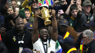 <p>MOMENTOUS OCCASION: South Africa's Siya Kolisi holds the Webb Ellis trophy as fans welcome South Africa's Springbok team during their arrival at O.R Tambo's international airport in Johannesburg. Pic: AP Photo/Themba Hadebe</p>