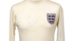 <p>The shirt still features Sir Bobby’s autograph (Mark Laban/Hansons/PA)</p>