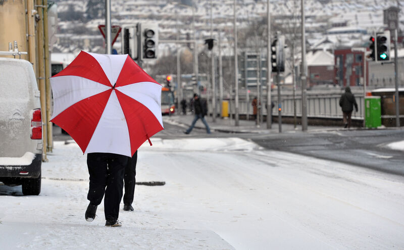 A man under a red umbrella making his way down Anderson’s Quay in Cork, during the Beast from the East in 2018. Picture: Dan Linehan A man under a red umbrella making his way down Anderson’s Quay in Cork, during the Beast from the East in 2018. Picture: Dan Linehan