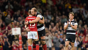 <p>Wales fullback Leigh Halfpenny (left) hugs Barbarians captain Alun Wyn Jones as he leaves the field after his final appearance for his country (Joe Giddens/PA).</p>