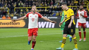 <p>Bayern's Harry Kane celebrates after scoring his side's 4th goal during the German Bundesliga soccer match between Borussia Dortmund and Bayern Munich in Dortmund, Germany, Saturday, Nov. 4, 2023. (AP Photo/Martin Meissner)</p>