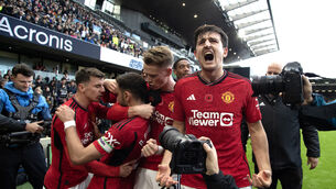 <p>LATE, LATE SHOW: Manchester United's Bruno Fernandes (second left) celebrates scoring their side's first goal of the game with Harry Maguire and team-mates during the Premier League match at Craven Cottage.</p>