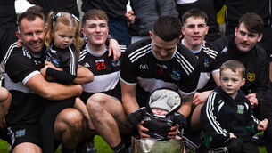<p class="contextmenu internal_Caption">SNUGGLED UP: Newcastle West joint-captain Iain Corbett with his son Dylan, who was born on Tuesday, October 31, 2023, after the Limerick County Senior Club Football Championship final match between Adare and Newcastle West at TUS Gaelic Grounds. Pic: Tom Beary/Sportsfile</p>