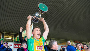 <p>BACK ON TOP: Dylan McHugh of Corofin lifts the Gaway SFC trophy. Pic: ©INPHO/Natasha Barton</p>