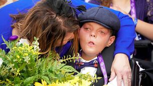 <p>INSPIRING FIGURE: Leslie Dorman with her son Cody after Cody's Wish won last year's Breeders' Cup Dirt Mile. 	Picture: Dylan Buell/Getty Images</p>
