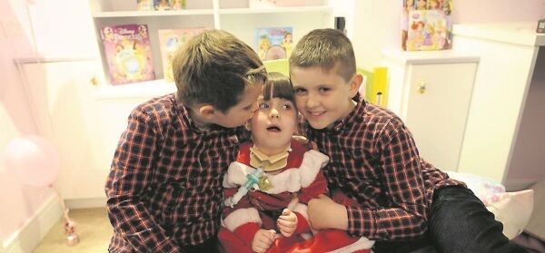 Kate O’Flynn in her new bedroom with brothers Alex and Adam. Picture: Gavin Browne Kate O’Flynn in her new bedroom with brothers Alex and Adam. Picture: Gavin Browne