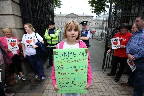 Ciara Gore from Waterford, 11, joins protesters outside Leinster House in calling for a 24/7 cardiac facility for the South East.