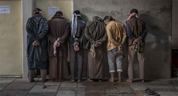 Captives are lined up in the city of Mosul, the site of heavy fighting with Islamic State.