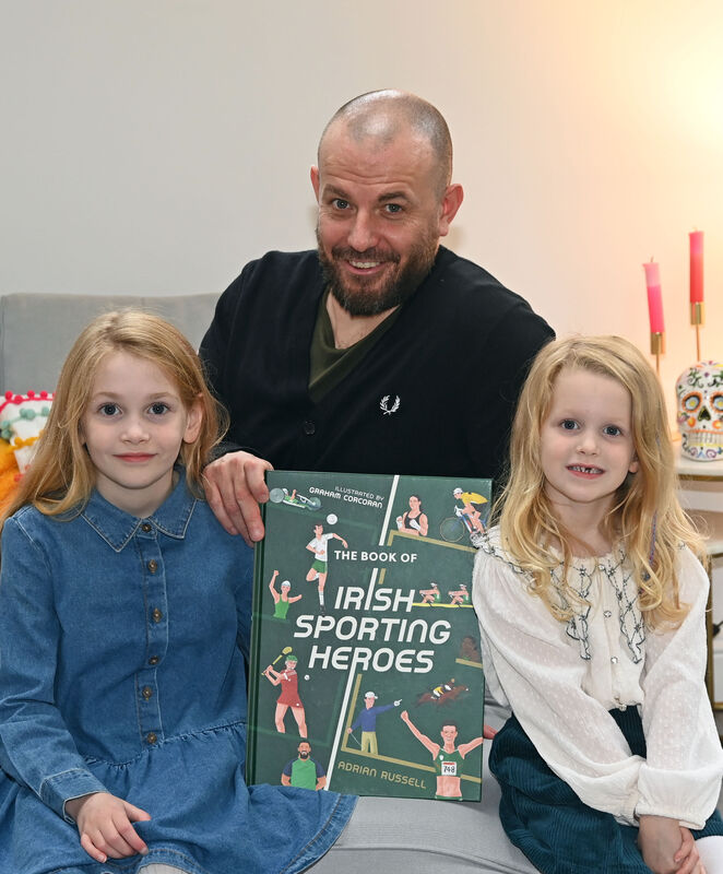 Author Adrian Russell with his daughters Robin and Ruby. Pic: Denis Minihane.