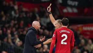 <p>FLASH POINT: Manchester United manager Erik ten Hag gets a yellow card Referee Graham Scott during the Premier League match at Old Trafford, Manchester. Pic Martin Rickett/PA Wire.</p>