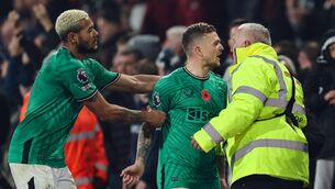 <p>FLASH POINT: Newcastle United's English defender #02 Kieran Trippier (C) argues with a supporter as Newcastle United's Brazilian striker #07 Joelinton (L) pulls him back at the end of the English Premier League football match between Bournemouth and Newcastle united at the Vitality Stadium in Bournemouth, southern England on November 11, 2023. Bournemouth wins 2 - 0 against Newcastle united. Pic: Adrian DENNIS / AFP</p>