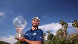<p>Max Homa of the United States poses with the trophy as he celebrates victory in Sun City, South Africa. Picture: Warren Little/Getty Images</p>