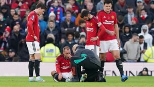 <p>Manchester United's Christian Eriksen sits injured during the Premier League match at Old Trafford.</p>